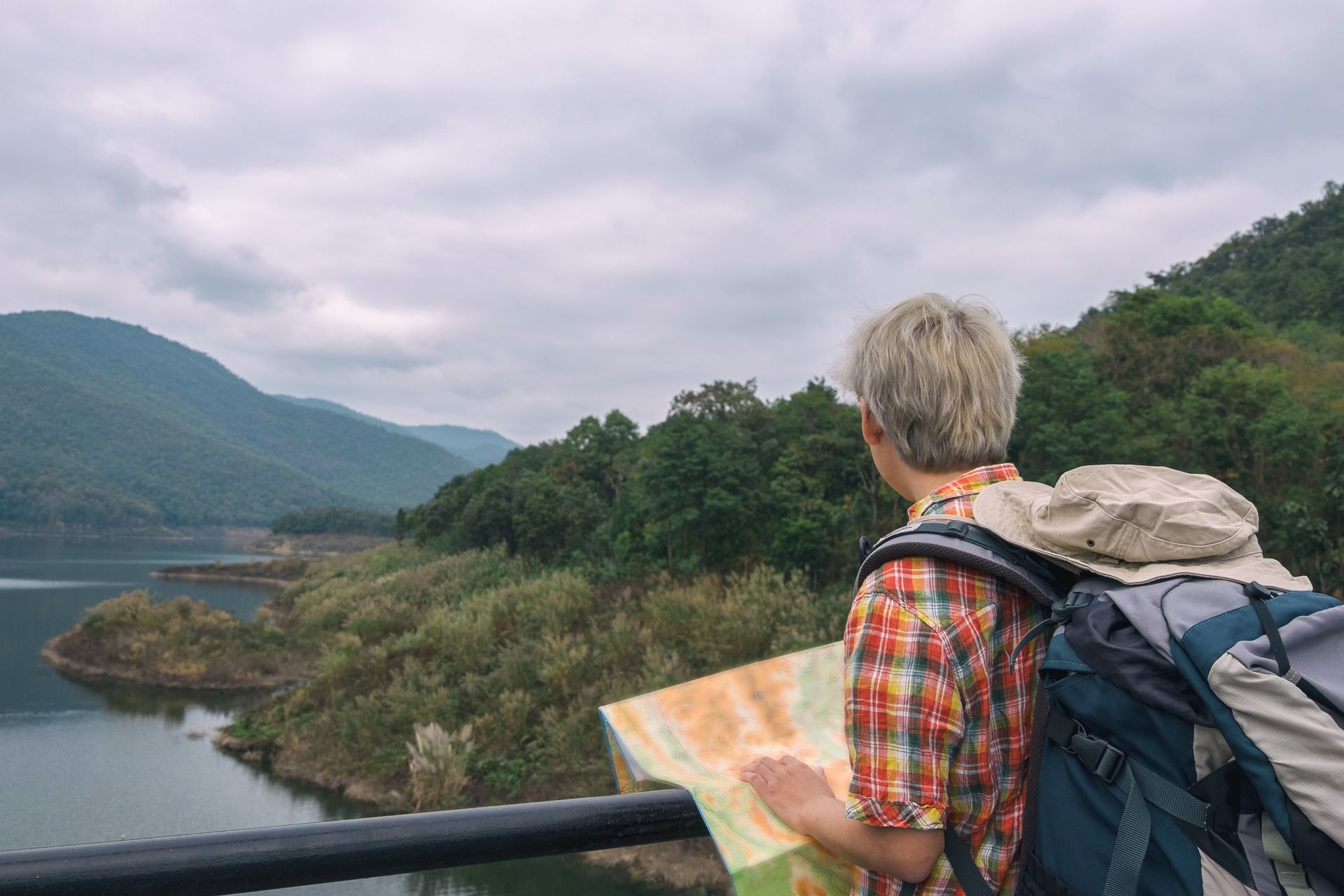 Trekking backpack and route map for trip planning