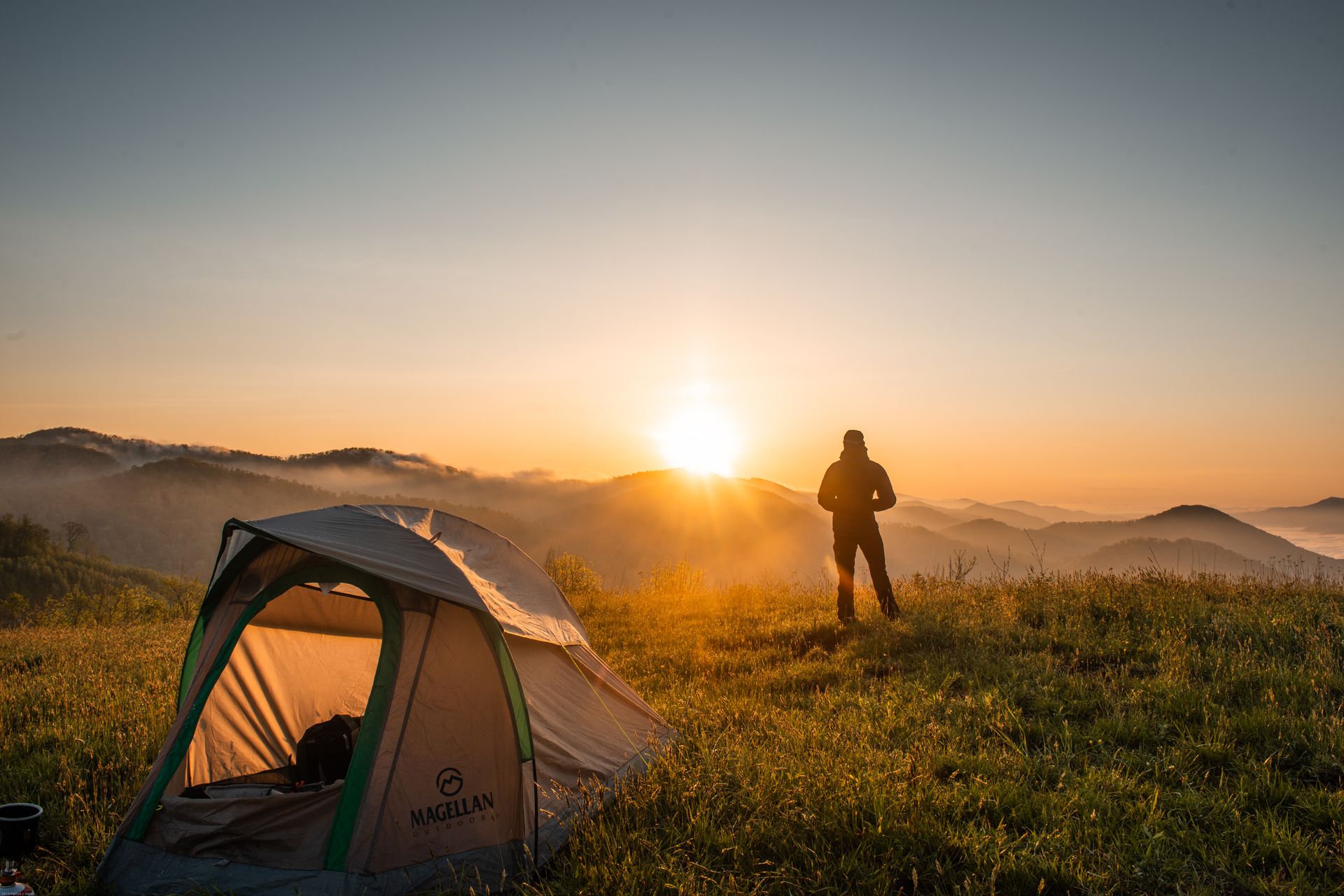 Tent camping at a scenic campsite at dusk